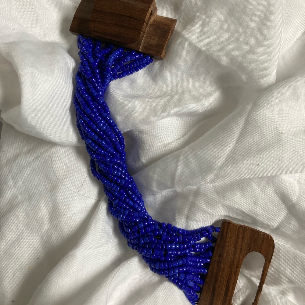 Ugandan bright blue bead bracelet with wooden clasp